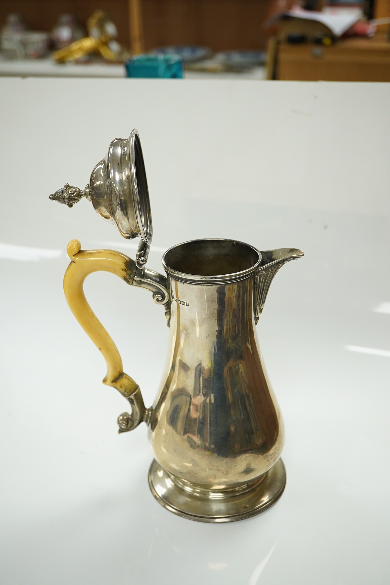 A George V silver baluster hot water pot with ivory handle, makers James Dixon & Sons, Sheffield 1915, gross 19.5 oz, fair to good condition. CITES Submission reference QELNYL3Z